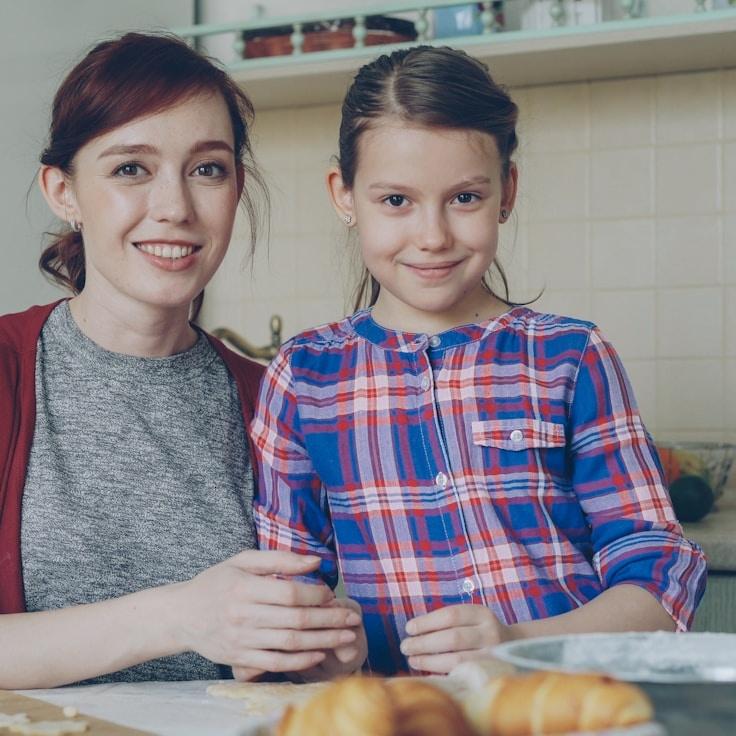 Kaveri Mehta, Lead Design Curator at GreenPaperIsland, reviewing corporate floral arrangements